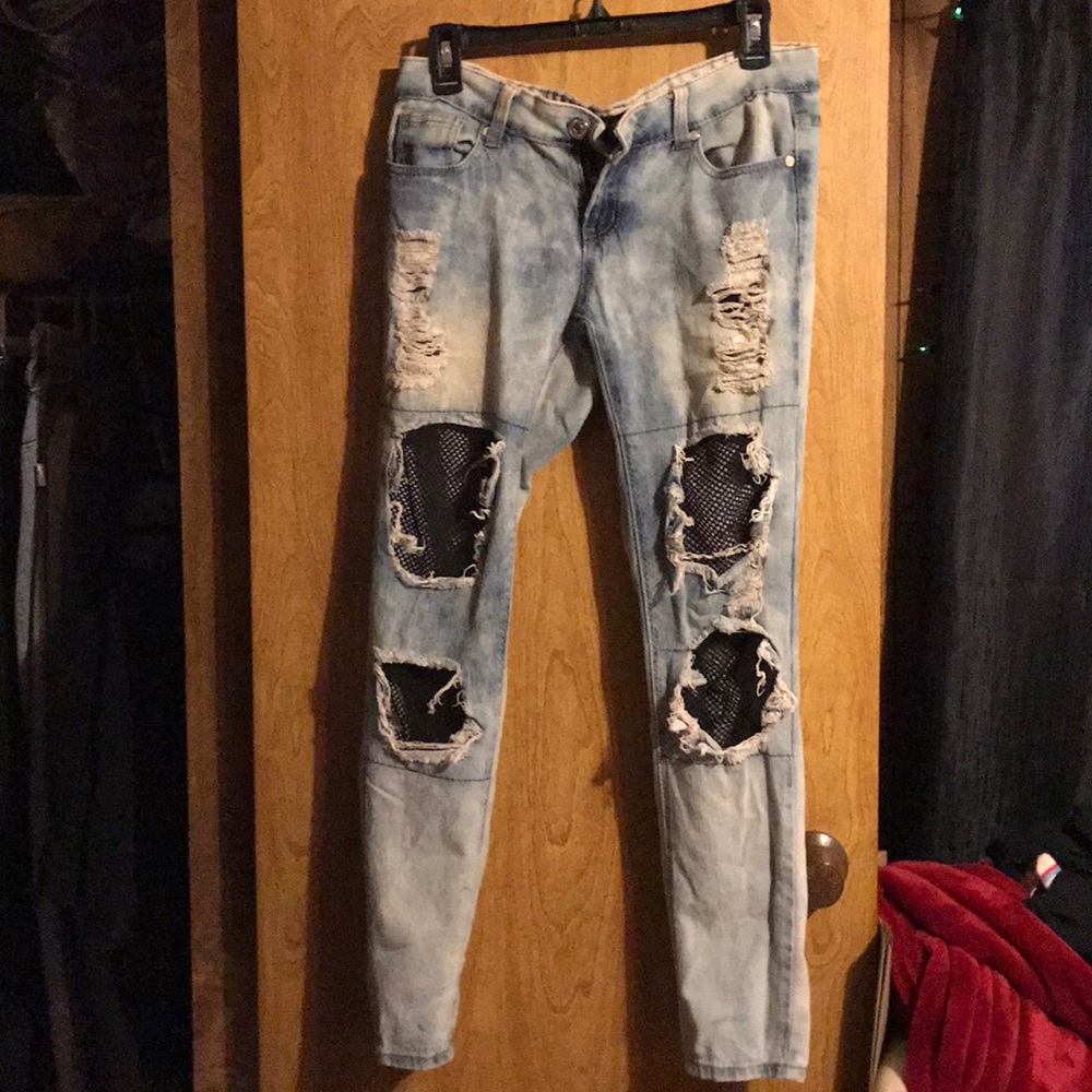 jeans with fishnet holes.